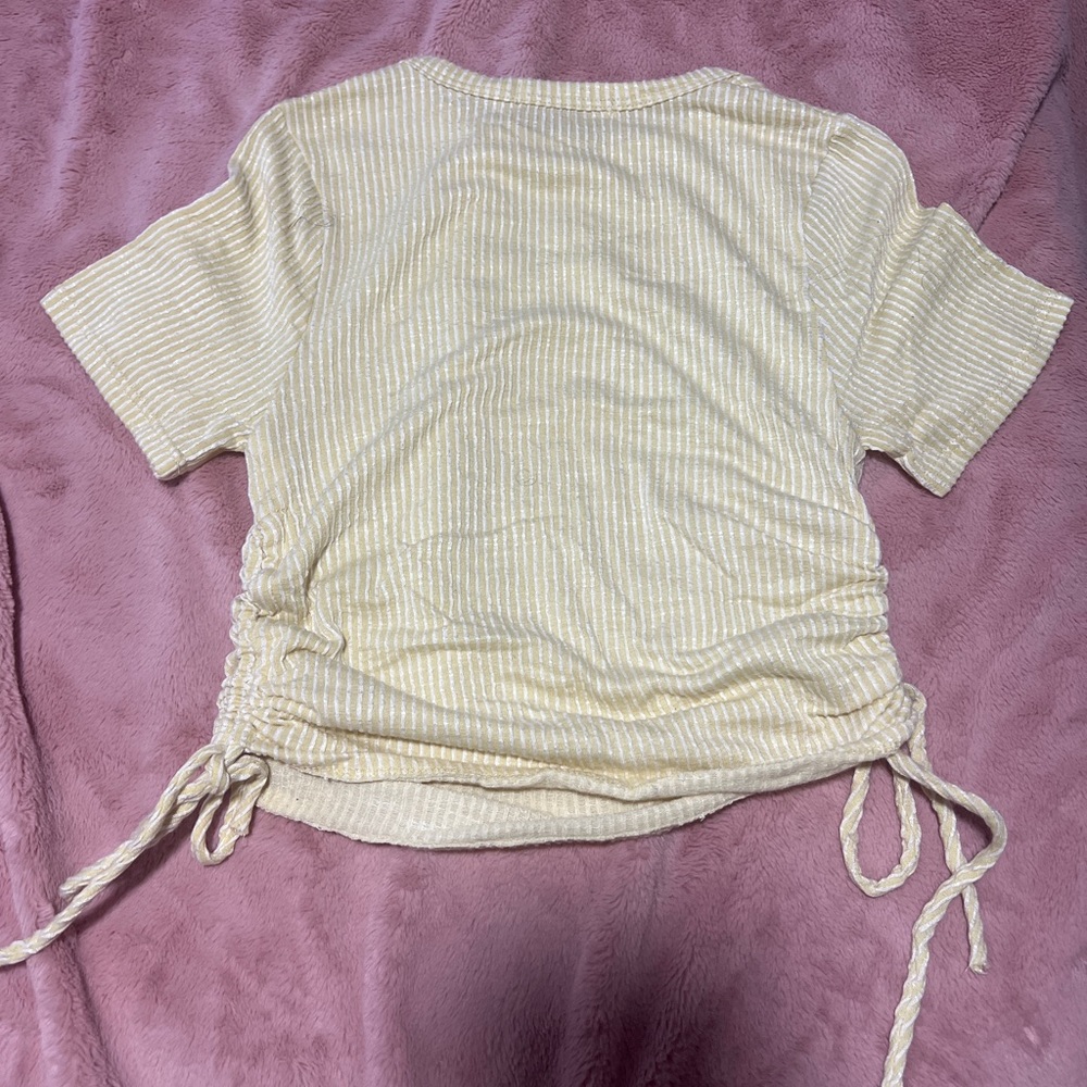 Light yellow shirt crop top